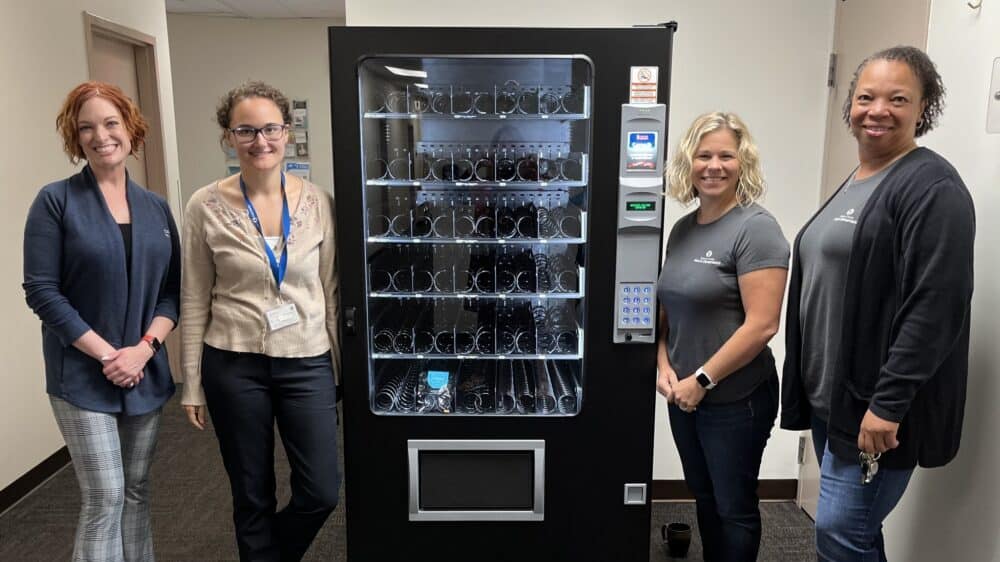 Saginaw County Health Department stands next to the first Naloxone vending machine in Great Lakes Bay region